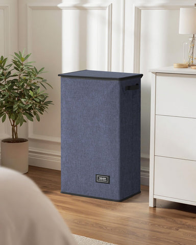 SOLEDI next to chair for scale showing 100L capacity and height
