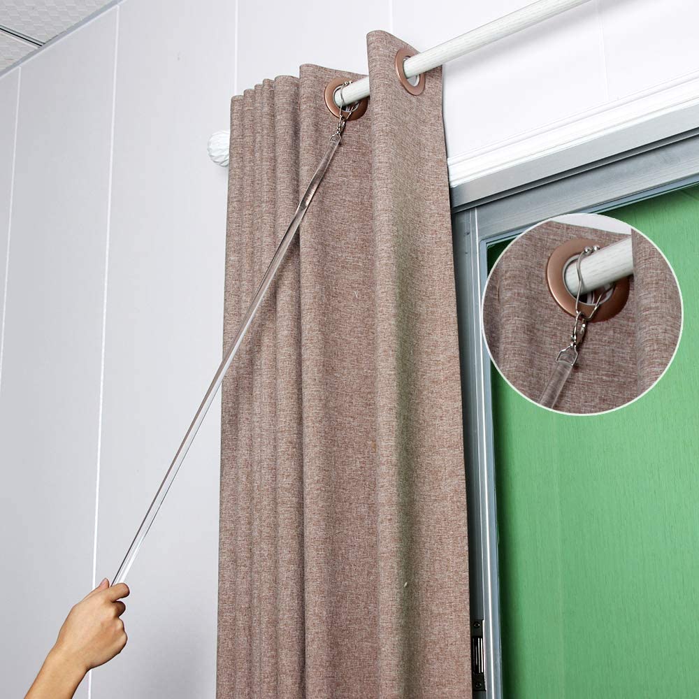 SOLOKOS wand threaded through a grommet curtain, enables hands-free smooth operation