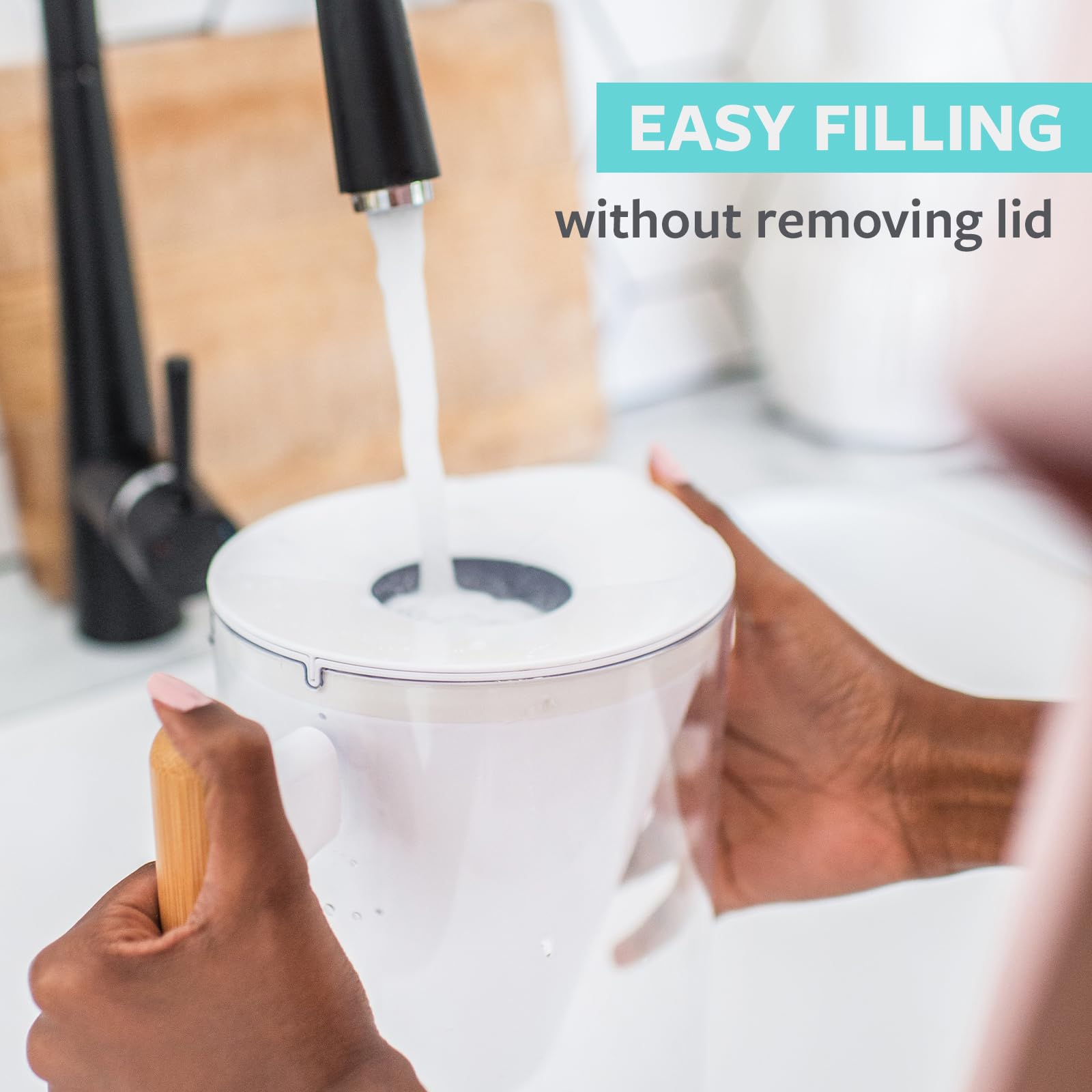 Soma pitcher top-fill trap door open for easy refill without removing lid