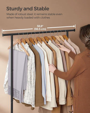 SONGMICS hanging rail with tape measure indicating 38.8 inches useful capacity