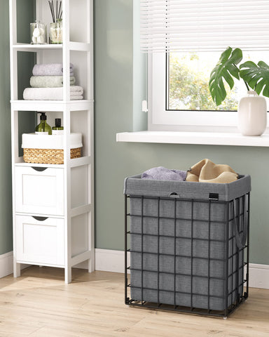 SONGMICS laundry hamper in bathroom setting showing discreet containment benefit
