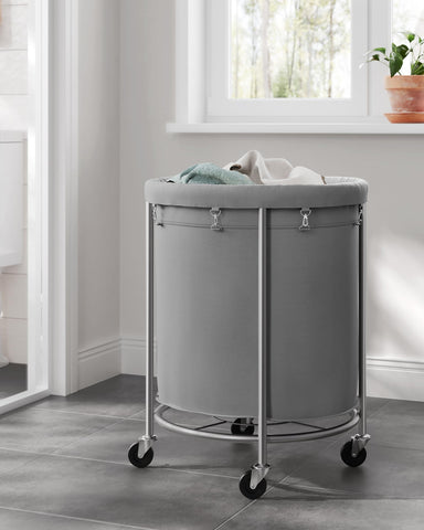 SONGMICS basket packed with bedding illustrating it holds bulky items easily