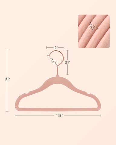 SONGMICS hangers beside a ruler showing child-size measurements