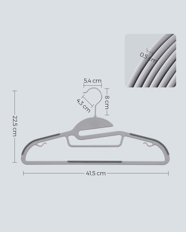 SONGMICS hanger thickness compared to ruler illustrating space-saving benefit