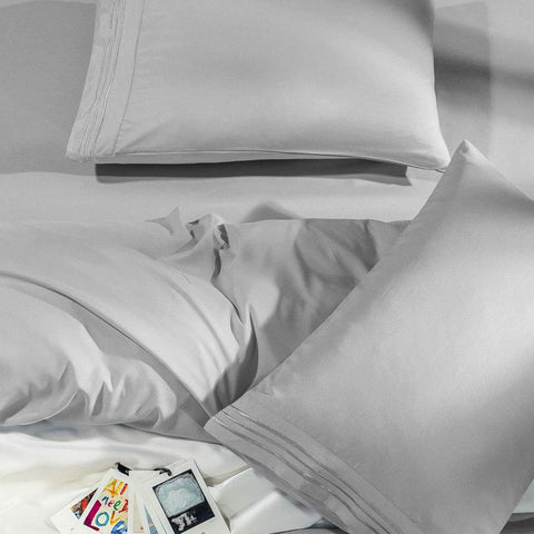 SONORO KATE styled bedroom with sheets on a made king bed conveying cozy elegance