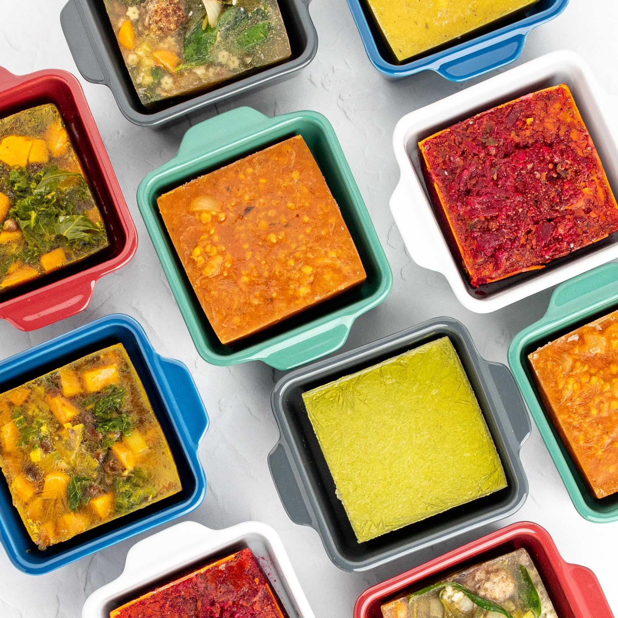 Souper Cubes stacked dishes with lids in fridge demonstrating space-saving organized storage