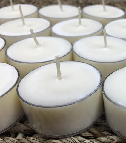 Soyworx burning tealight on table offering steady long-lasting light