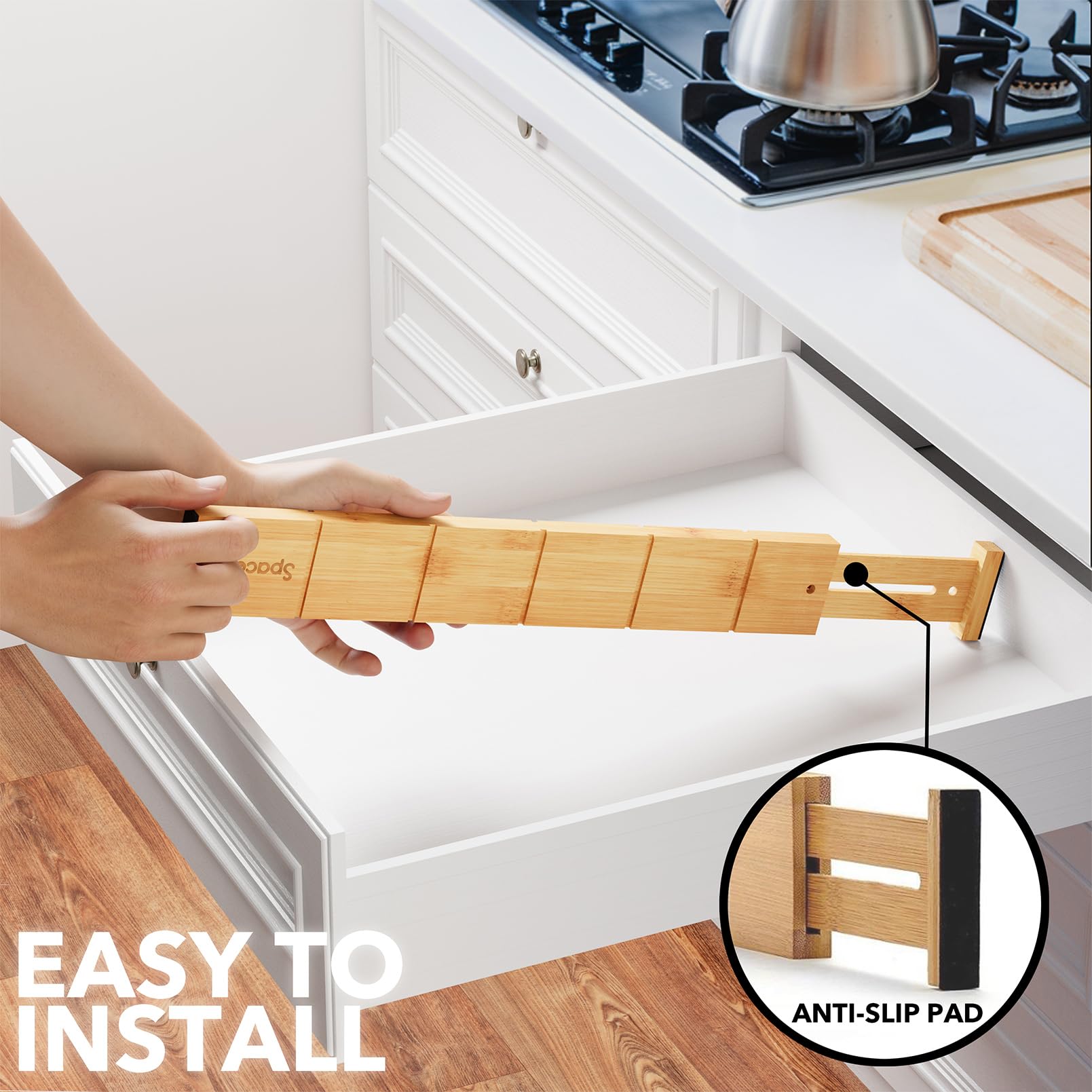 SpaceAid divider beside utensils to show scale and usable drawer coverage