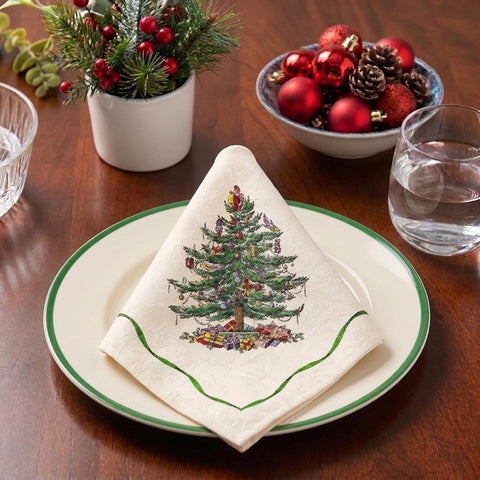 Spode napkin styled on table with plates demonstrating festive coordination