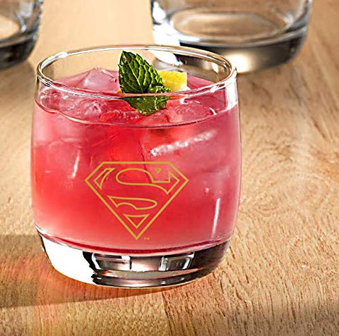 Spoontiques glasses on home bar shelf showcasing stylish superhero-themed drinkware