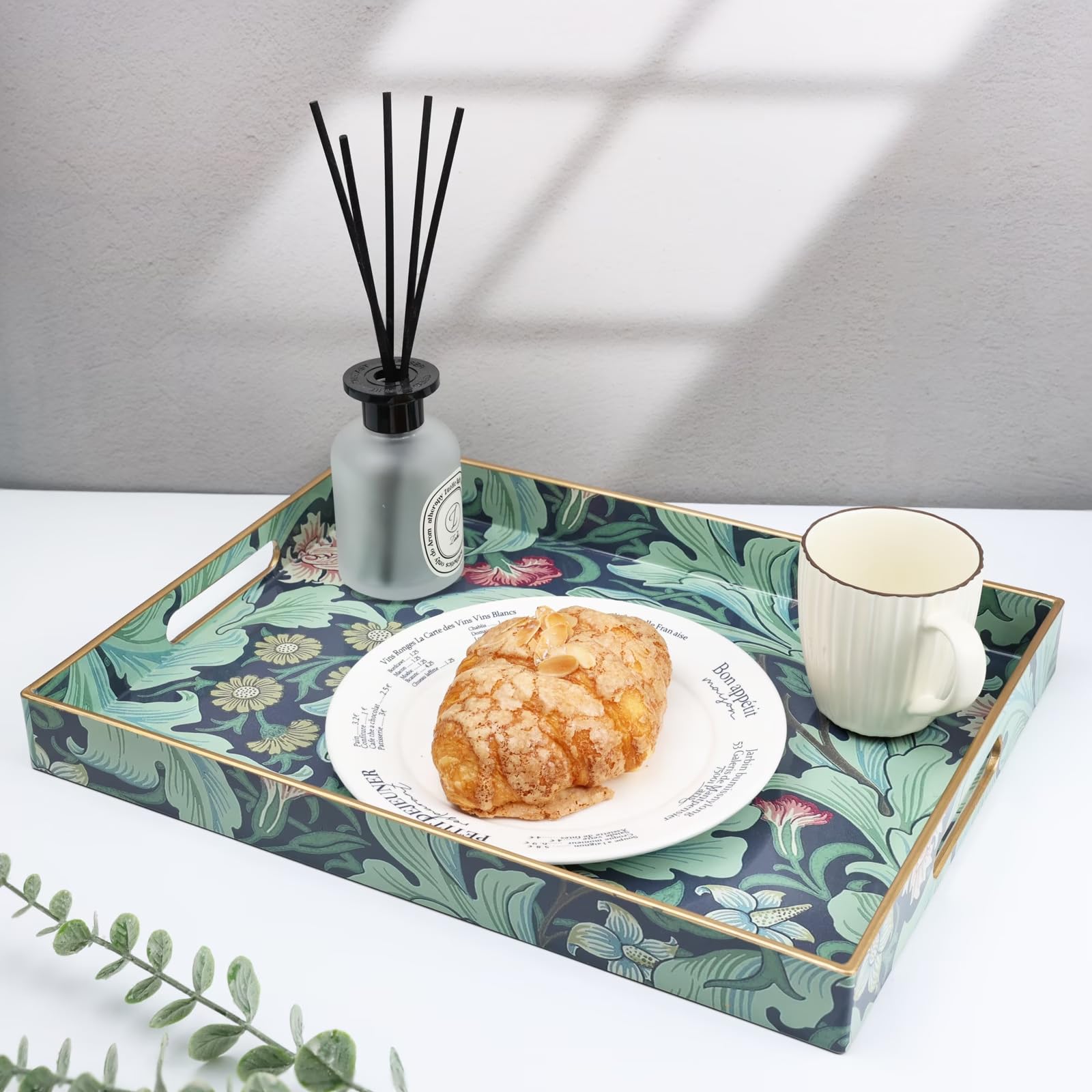Spsyrine on a coffee table with cups and plates, enhances casual entertaining