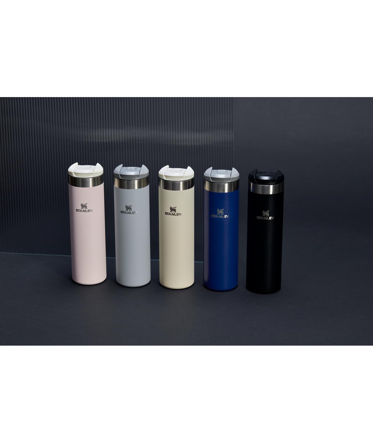 STANLEY bottle in commuter setting showing convenient one-hand use benefit