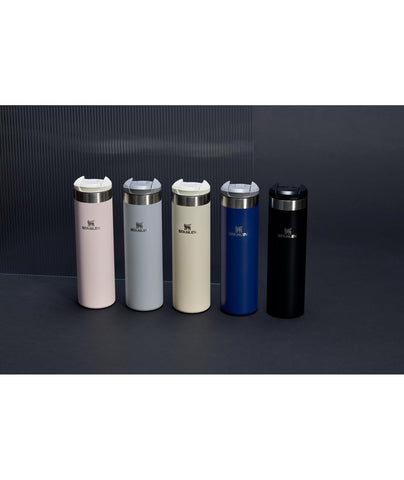 STANLEY bottle in commuter setting showing convenient one-hand use benefit