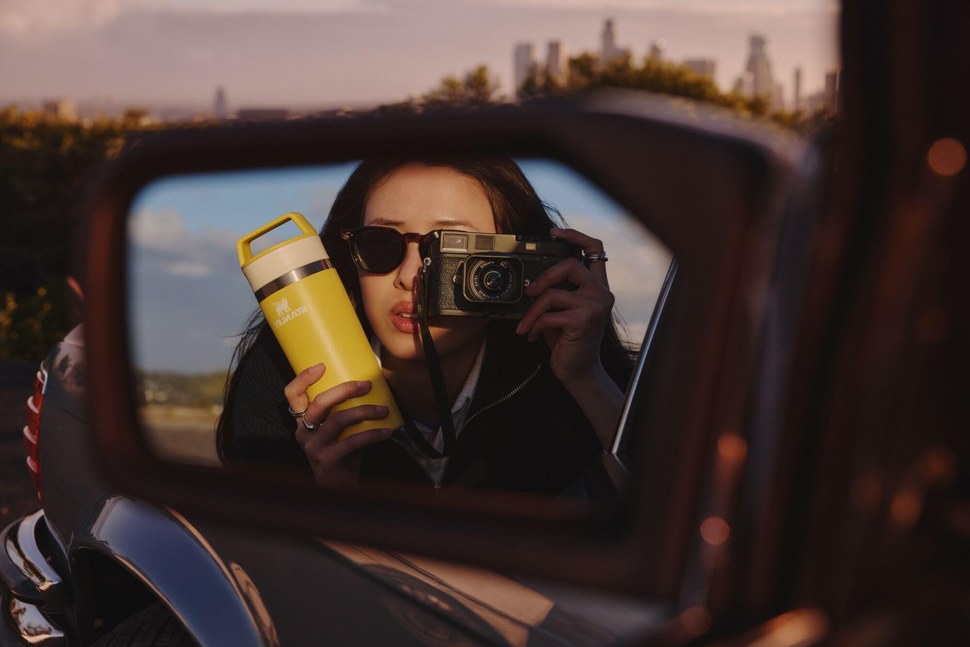 STANLEY commuter lifestyle scene showing mug in backpack ready for travel