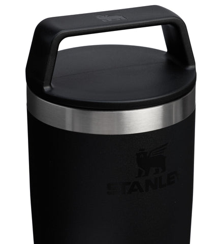 STANLEY mug held in hand to indicate compact 16 oz scale and portability