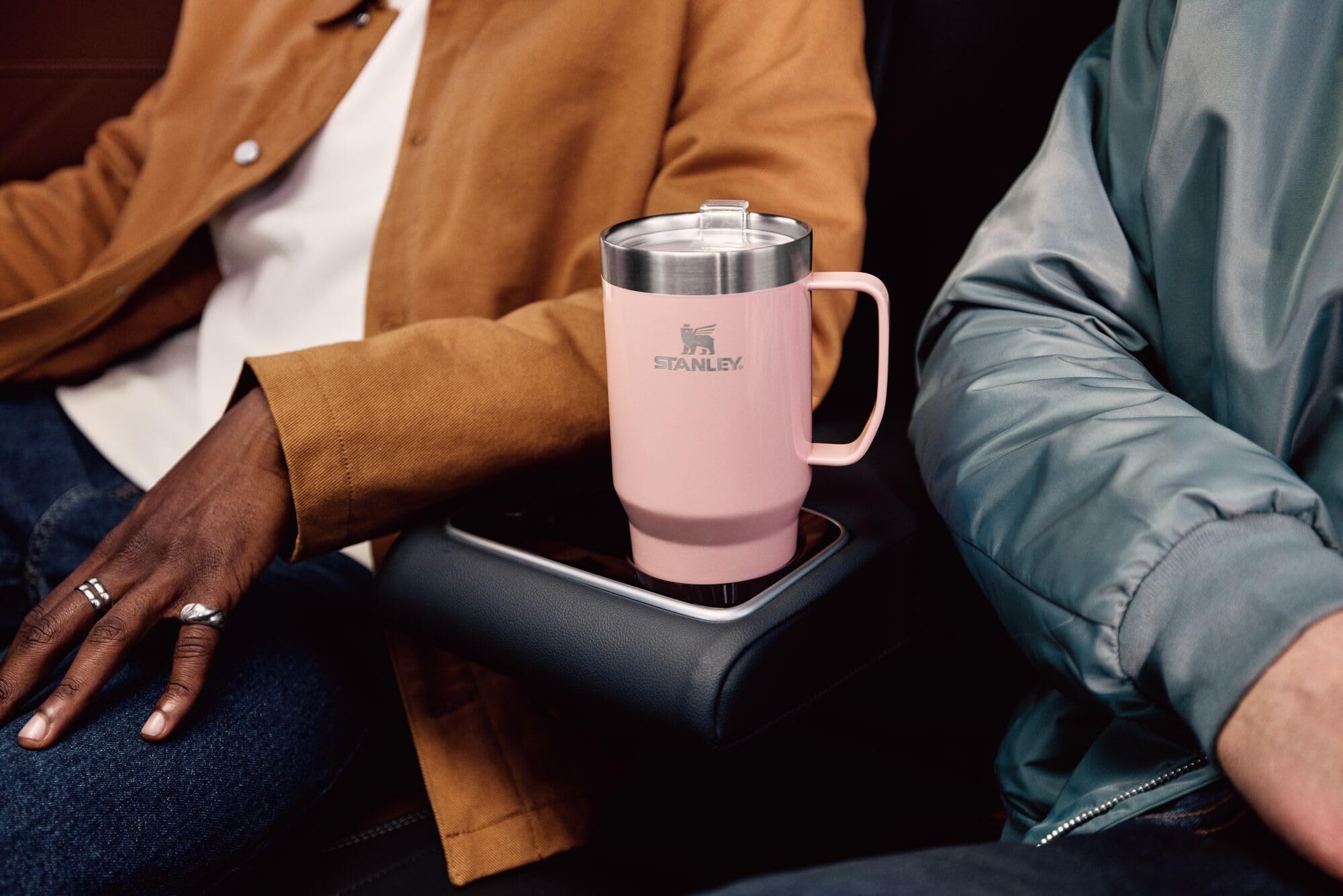 STANLEY mug next to a coffee cup showing 16 oz scale and portable capacity benefit