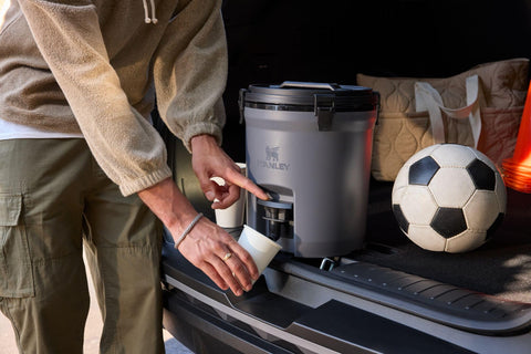 STANLEY jug on soccer sideline providing group hydration and quick, visible access