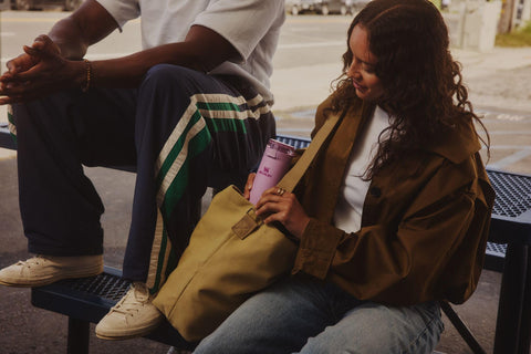 STANLEY Flowstate next to a phone showing 20 oz scale for everyday capacity