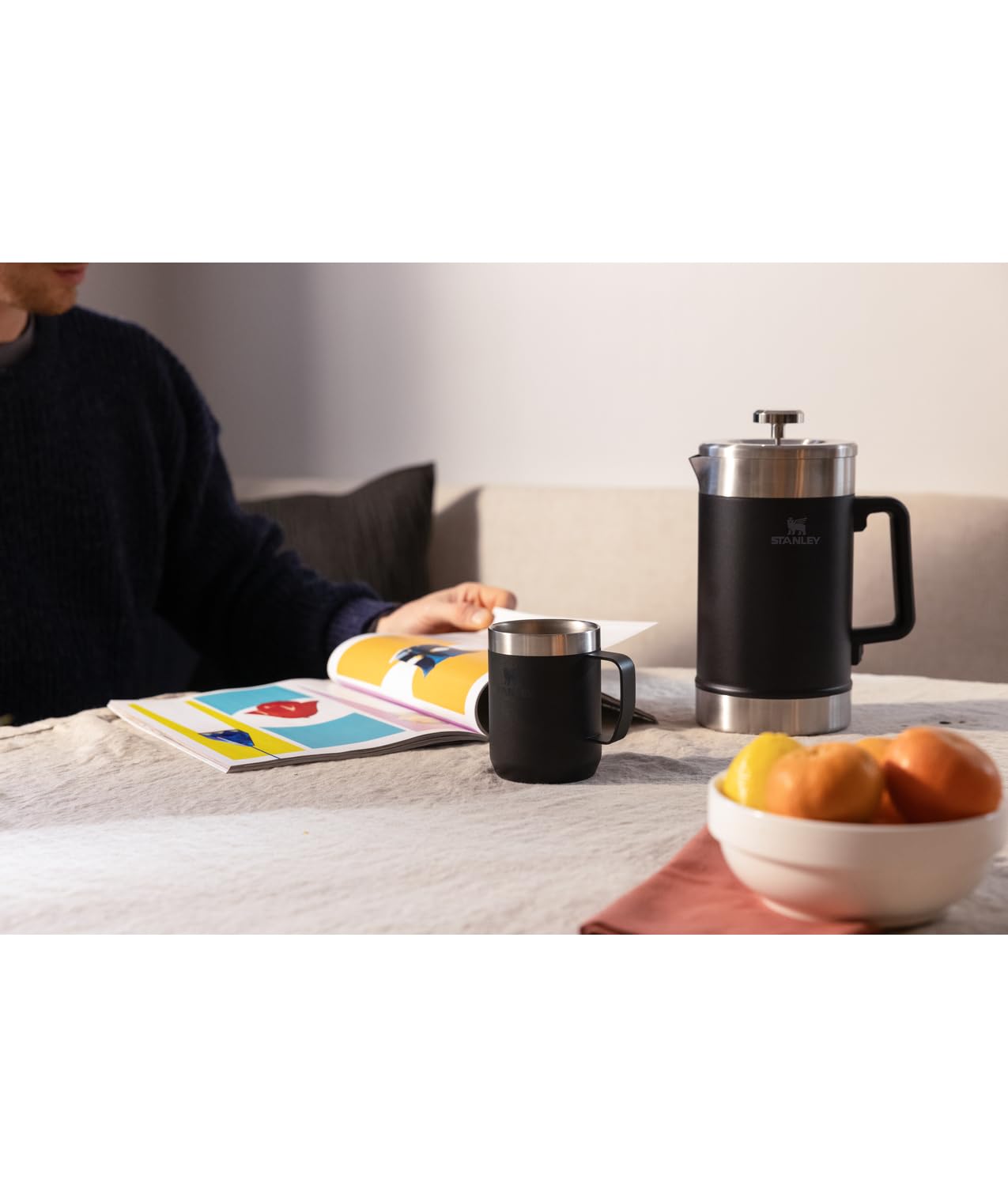 STANLEY pouring brewed coffee into cup showing easy pour and spill control benefit