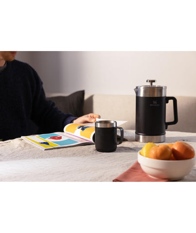 STANLEY pouring brewed coffee into cup showing easy pour and spill control benefit