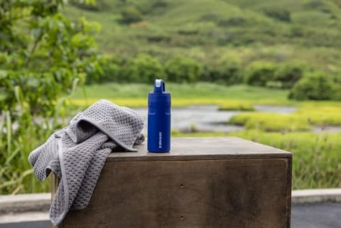 STANLEY bottle on a hiking trail showing outdoor-ready insulation benefit