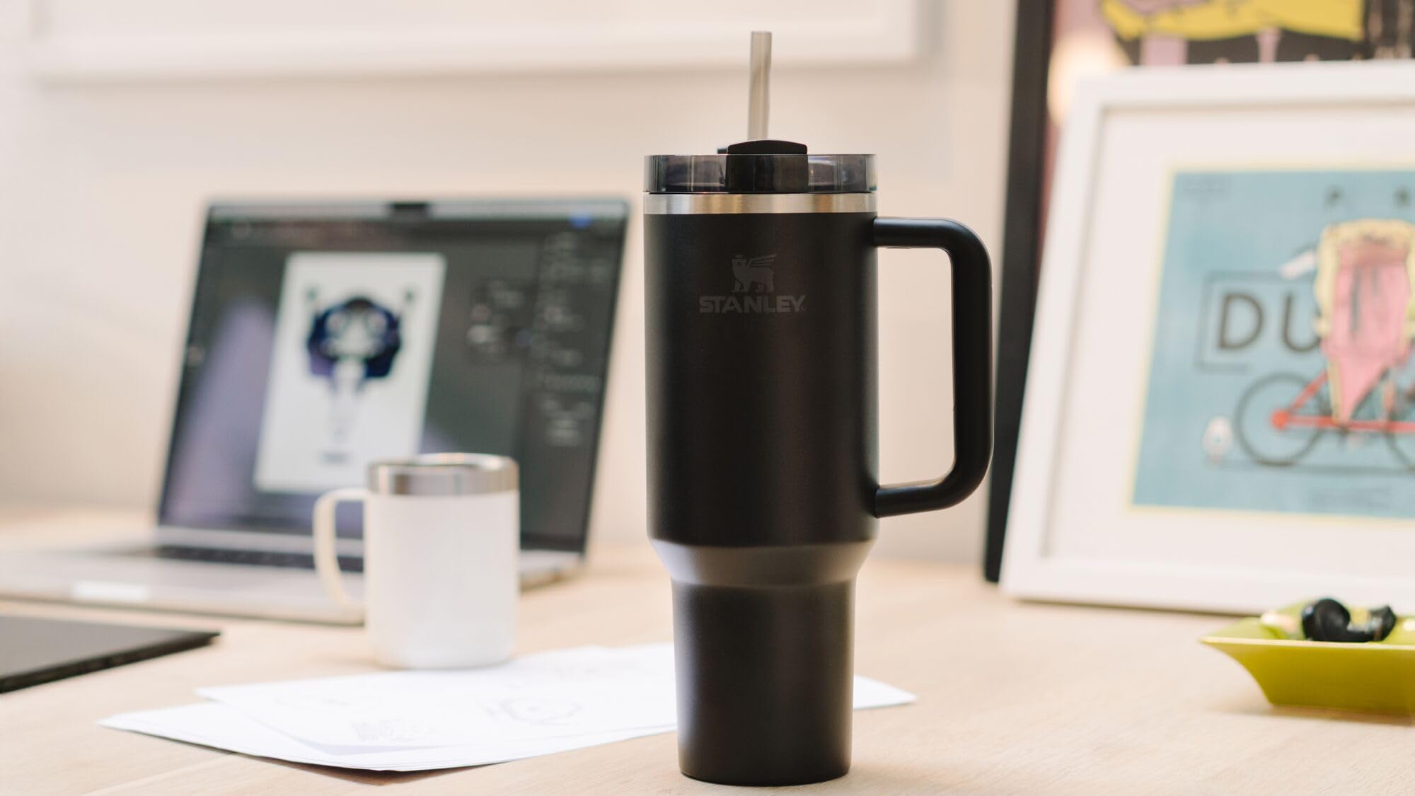 STANLEY narrow base seated in a car cup holder for travel-friendly portability