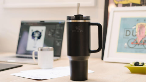 STANLEY narrow base seated in a car cup holder for travel-friendly portability