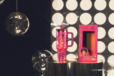 STANLEY Quencher staged with Barbie memorabilia emphasizing commemorative design
