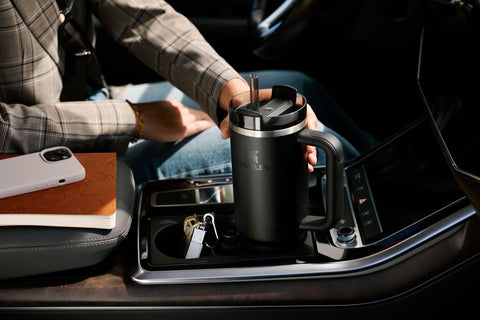 STANLEY tumbler on picnic table showing durable outdoor lifestyle benefit