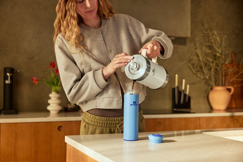 STANLEY mug on café table illustrating travel-ready style and everyday use