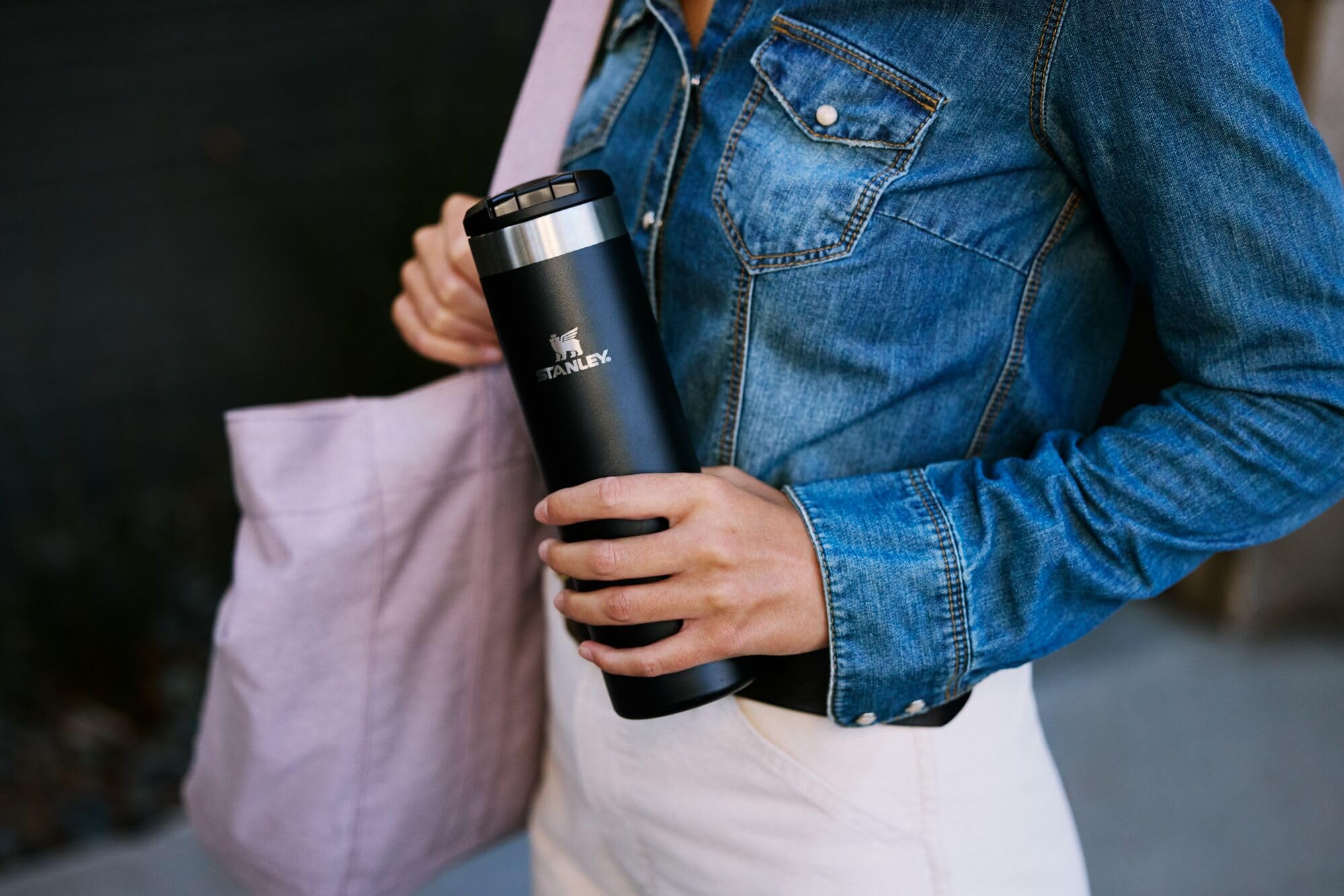 STANLEY mug held in hand to show 20 oz scale and lightweight AeroLight benefit