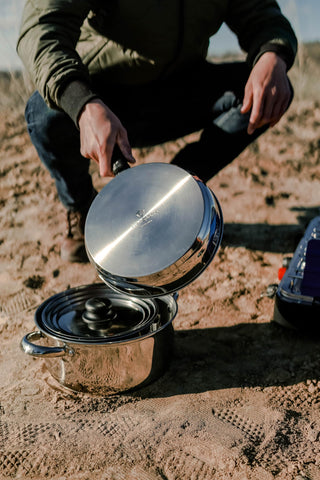 Stansport cook set in use over camp stove for dependable outdoor meals