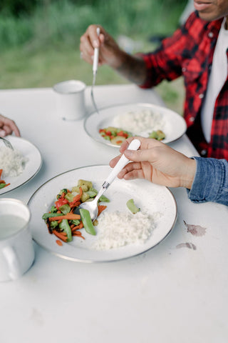 Stansport table setting in nature showing stylish enamelware for picnic or camp