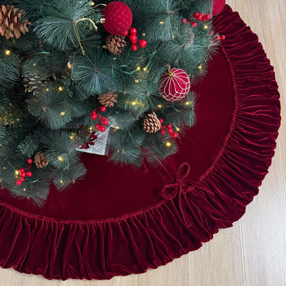 Starry Dynamo front view burgundy tree skirt showcasing elegant ruffle and coverage