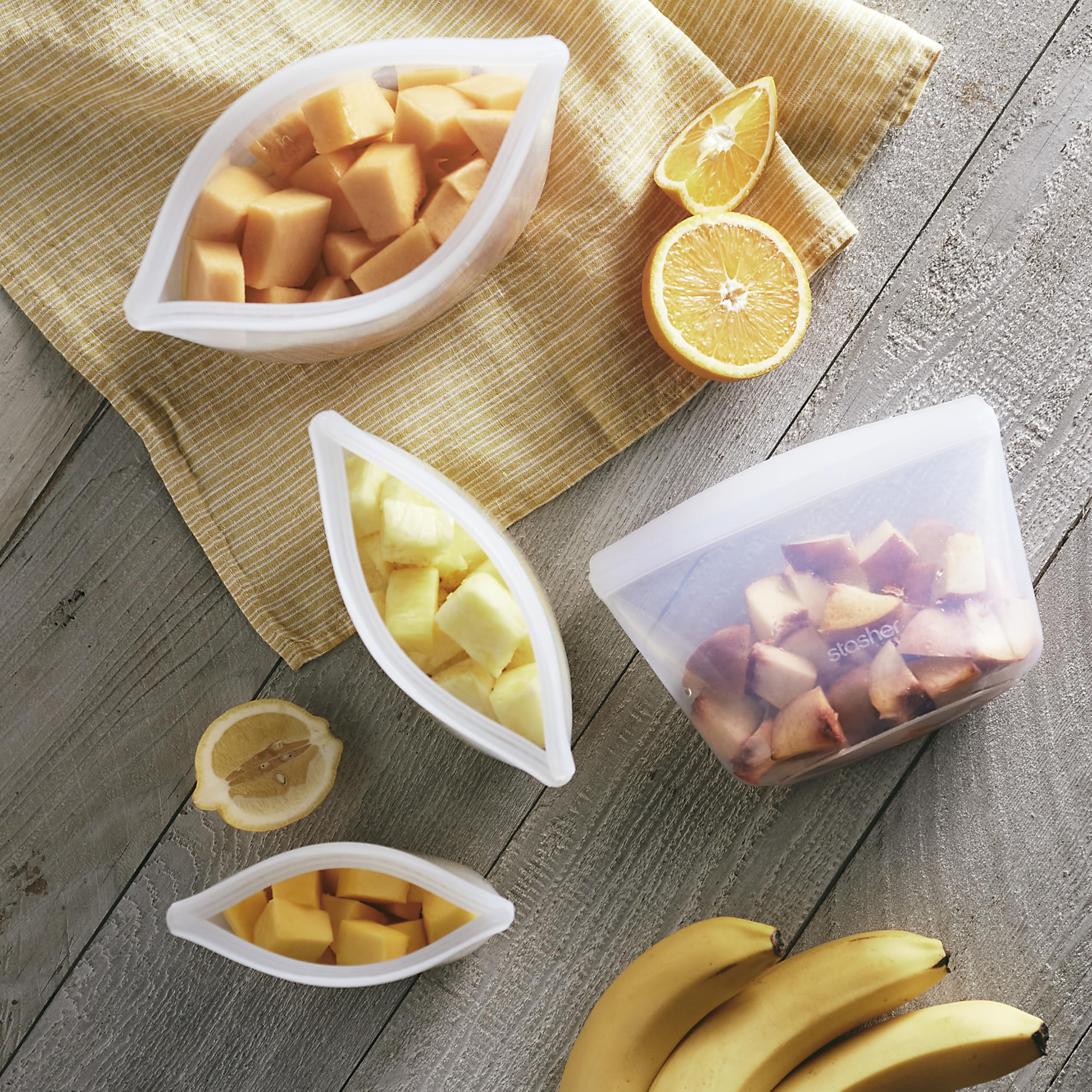 Stasher clear 6-cup bowl filled with salad so contents are visible for easy meal prep