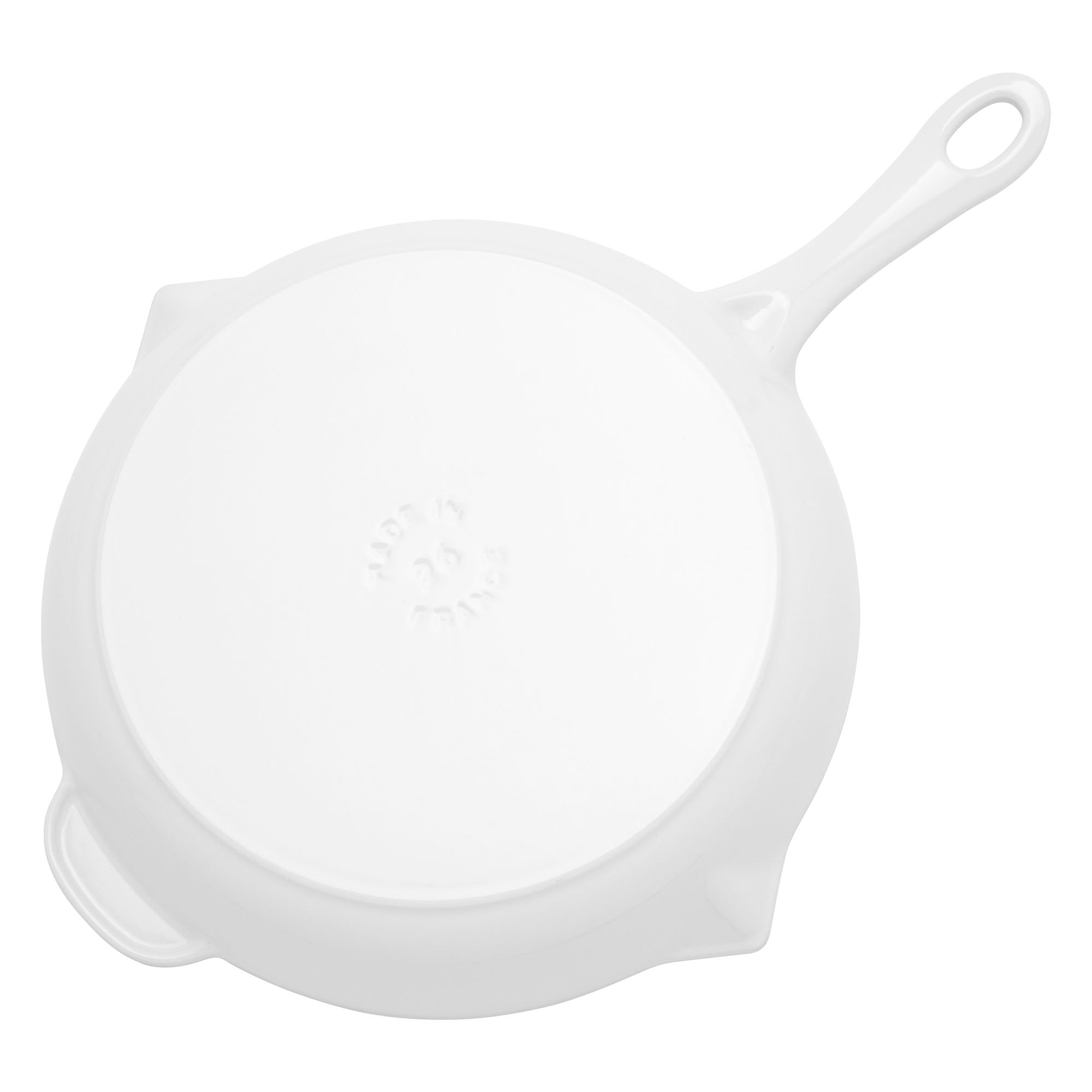 STAUB pan on induction cooktop showing compatibility and fast heating benefit
