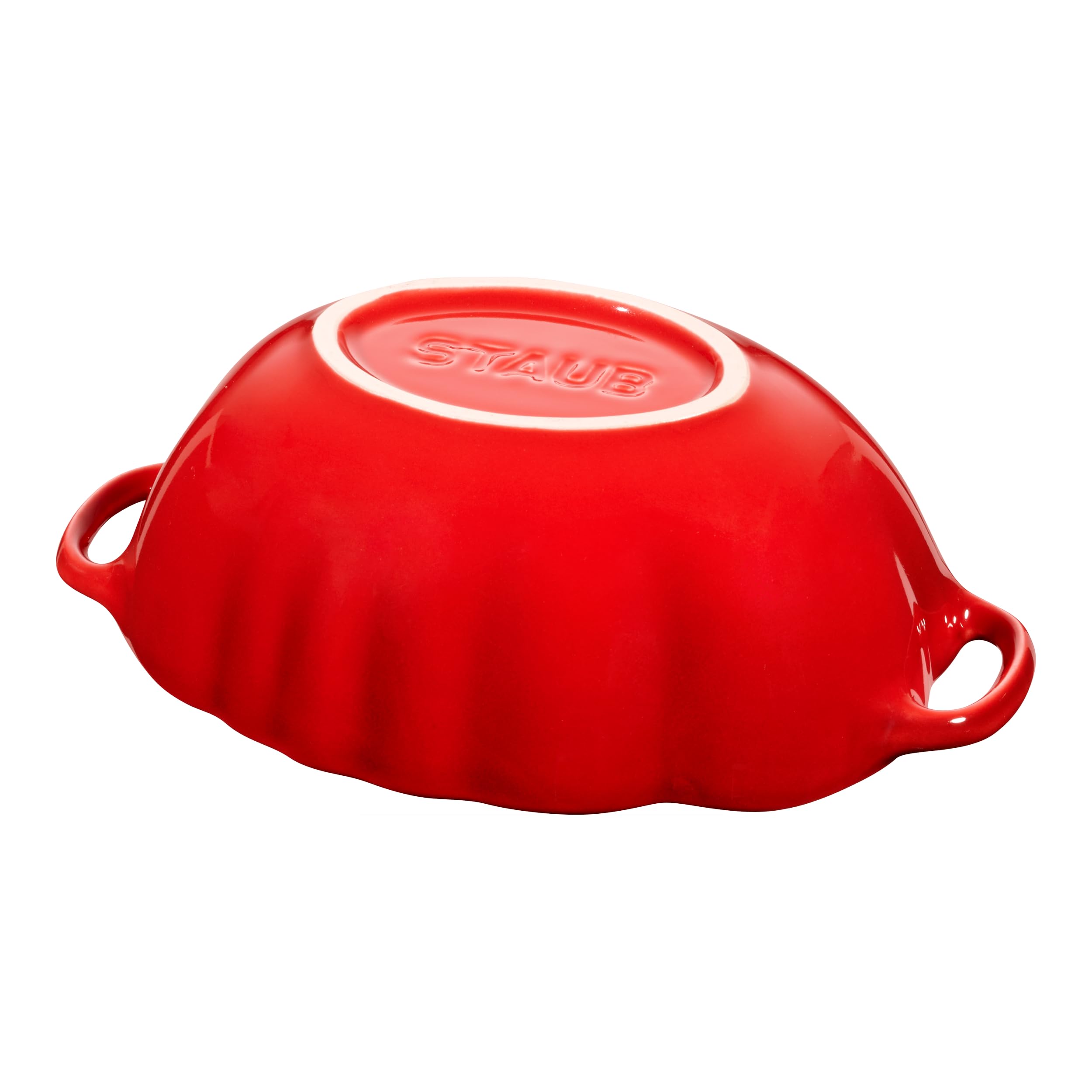 Staub tomato cocotte next to measuring cup for scale, clear size reference benefit