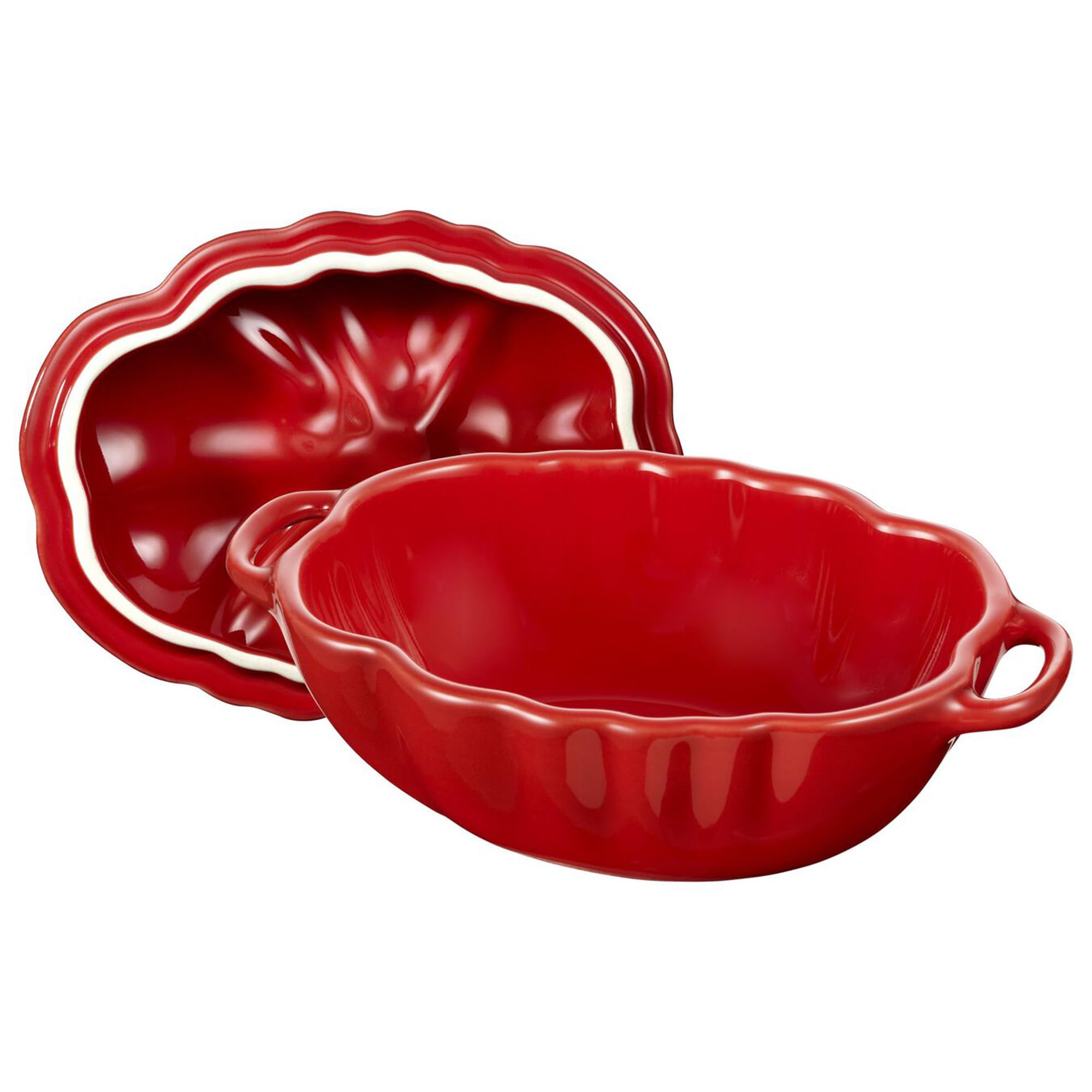 Staub tomato cocotte inside oven on rack, reliable oven-safe performance benefit