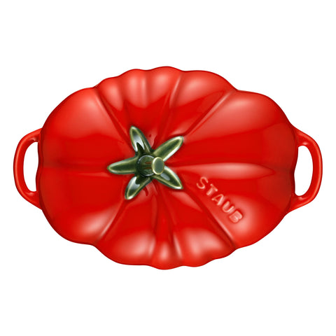 Staub tomato cocotte served on dining table, elevates presentation for guests benefit