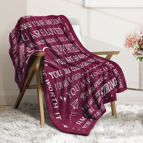 SteadStyle blanket draped on a couch demonstrating warmth and daily comfort