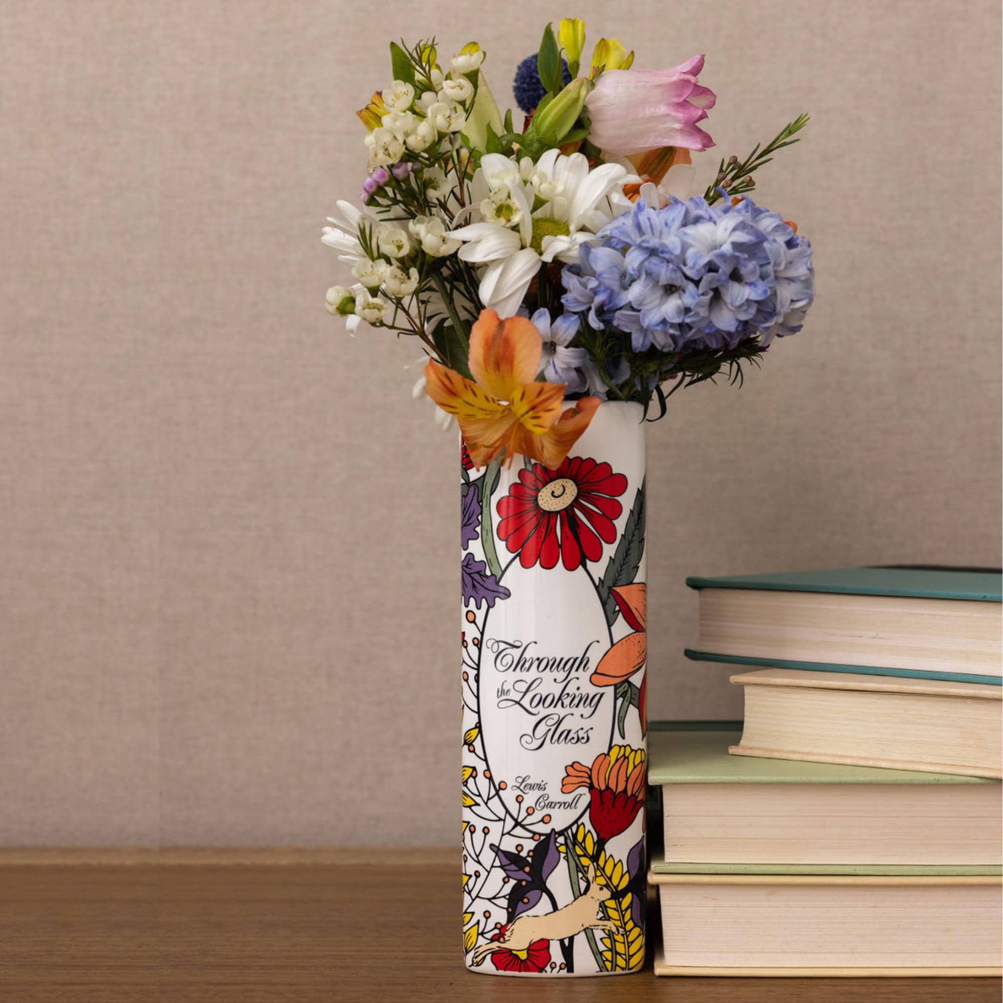 Steel Mill & Co. vase on a bookshelf blending with books for literary styling benefit