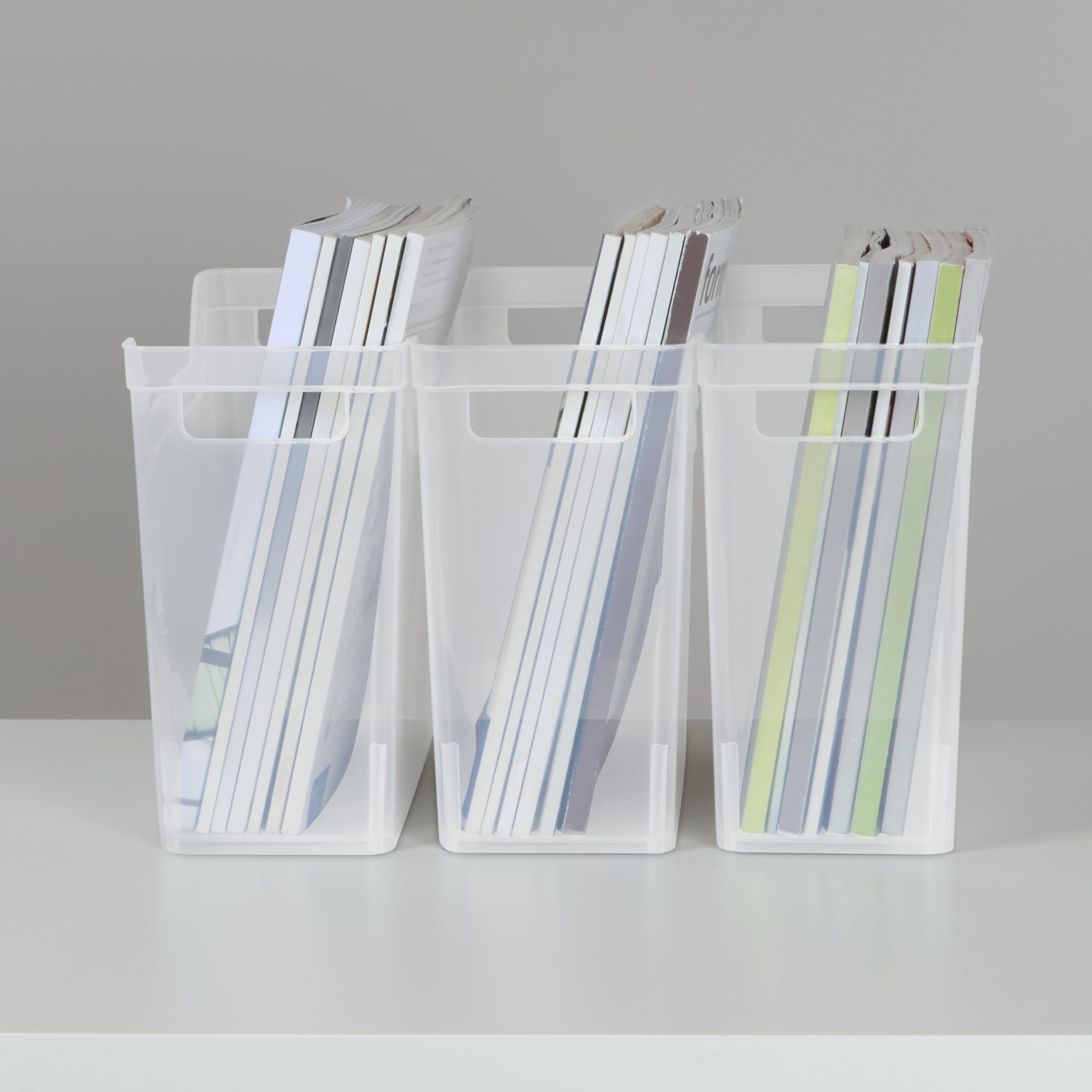 Sterilite narrow shelf bin on shelf alongside books to show size and fit