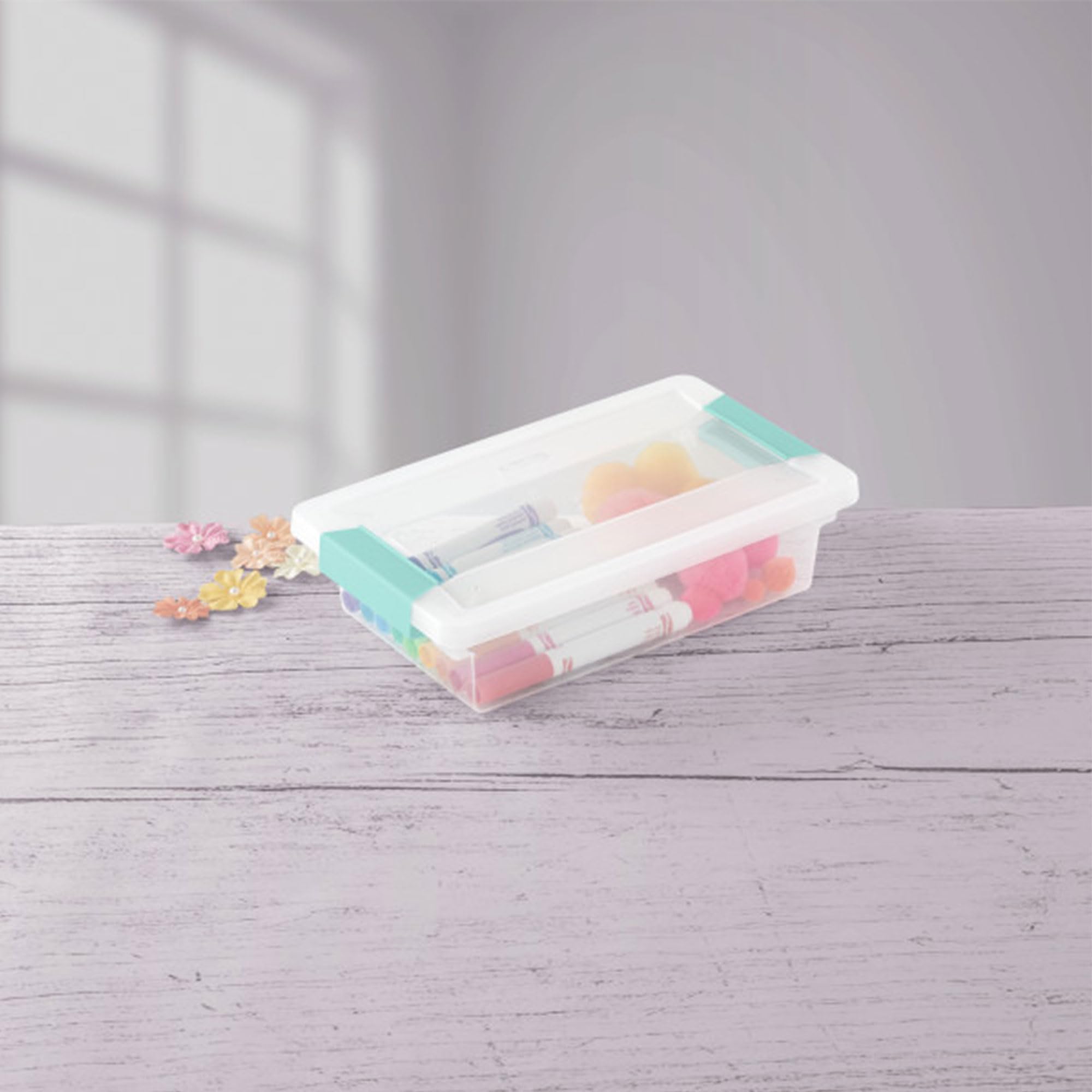 Sterilite box filled with craft supplies illustrating neat sorting and visibility
