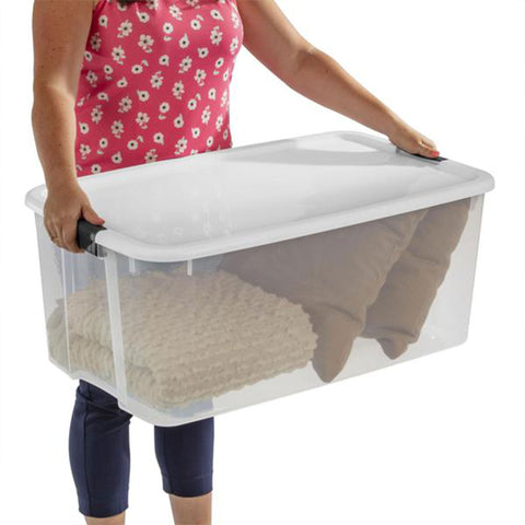Sterilite bin beside a chair showing scale and large 116-quart capacity advantage