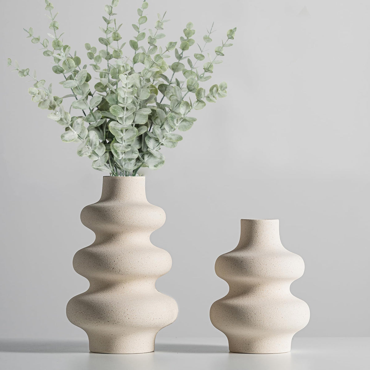 Steviieden front view of both off-white vases showing sculptural benefit