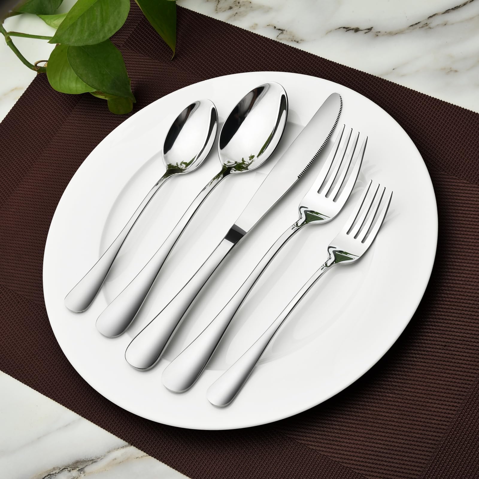 Stilloye utensils next to a ruler showing scale and consistent sizing for a service of twelve