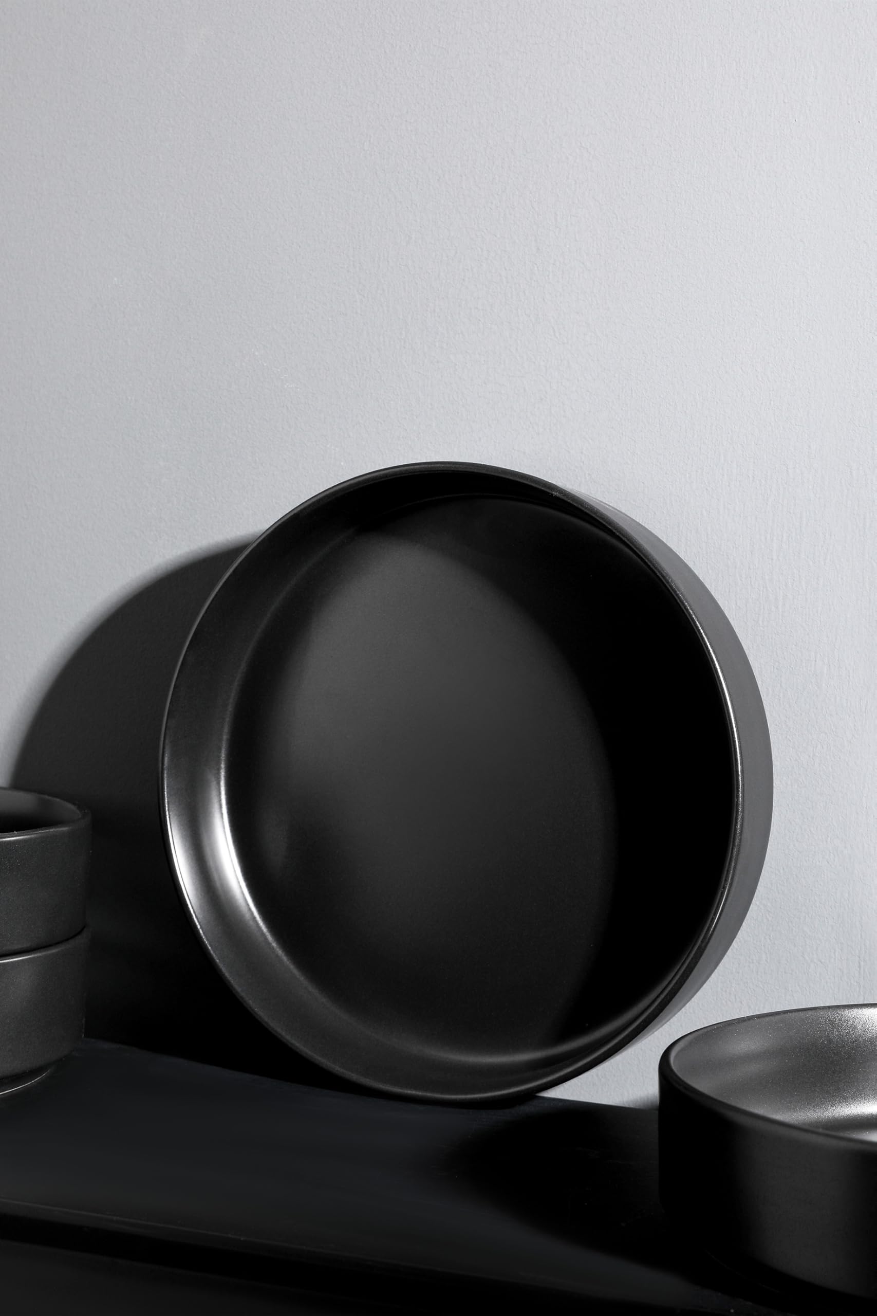 Stone Lain stacked Celina bowls beside cutlery illustrating compact storage and scale