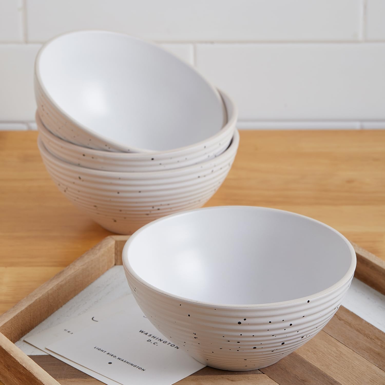 Stone Lain Lauren plate held by hand for scale showing generous size and sturdy weight