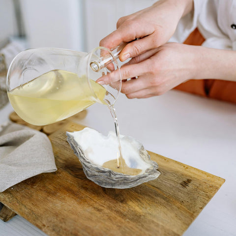 stonechic table setting with shells enhances beach-themed styling