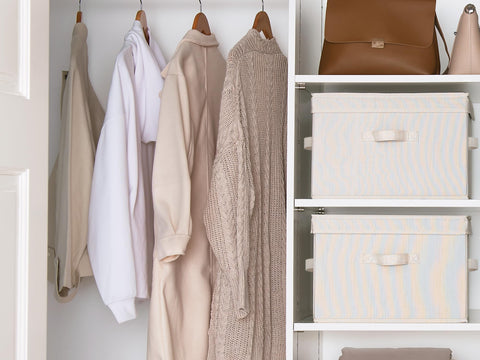 StorageWorks open bin with folded towels demonstrating organized storage